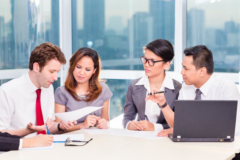 Asian Business Team in Strategy meeting royalty free stock photo Asian Business Team in Strategy meeting royalty free stock photo