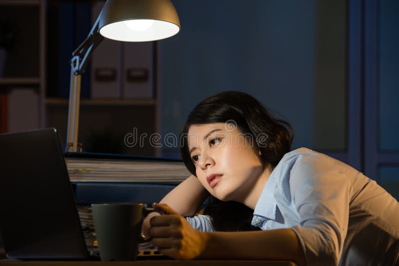 Asian business woman sleepy working overtime late night royalty free stock image Asian business woman sleepy working overtime late night royalty free stock image