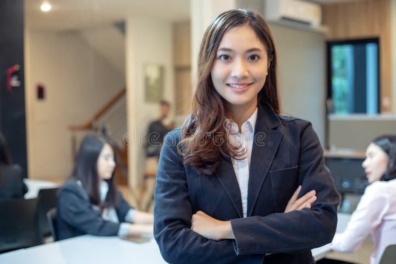 Asian business women and group using notebook for meeting and bu