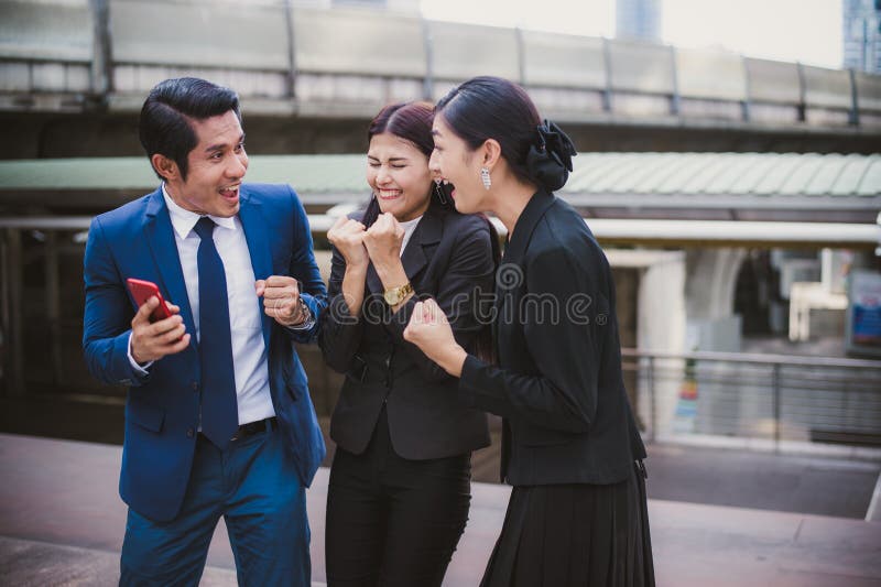Asian businessman and businesswoman smile and cheerful for successful in mission. royalty free stock photo Asian businessman and businesswoman smile and cheerful for successful in mission. royalty free stock photo