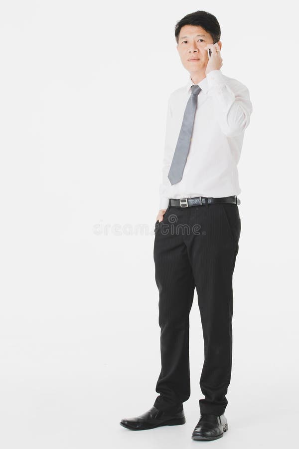 Asian businessman, in white shirt holding use calling smartphone royalty free stock images Asian businessman, in white shirt holding use calling smartphone royalty free stock images