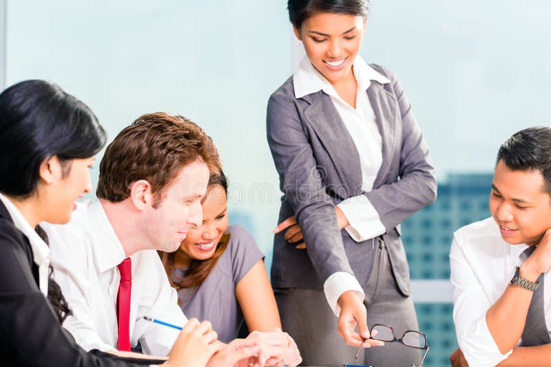 Asian Businesspeople having meeting royalty free stock photography
