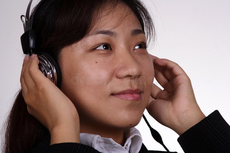 Asian businesswoman listening