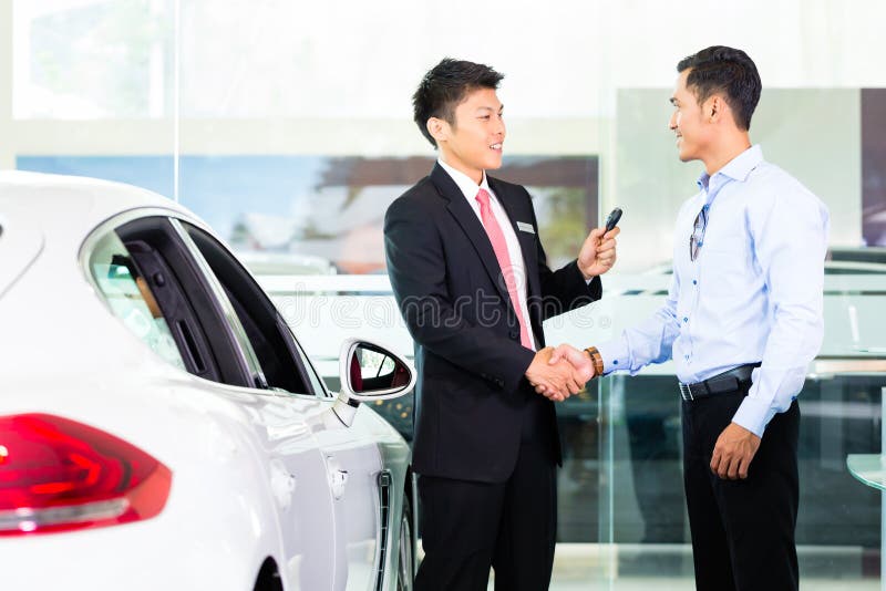 Asian Car Salesman selling auto