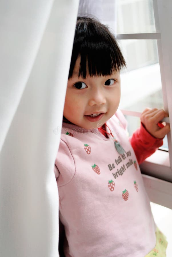 Asian child Front the window