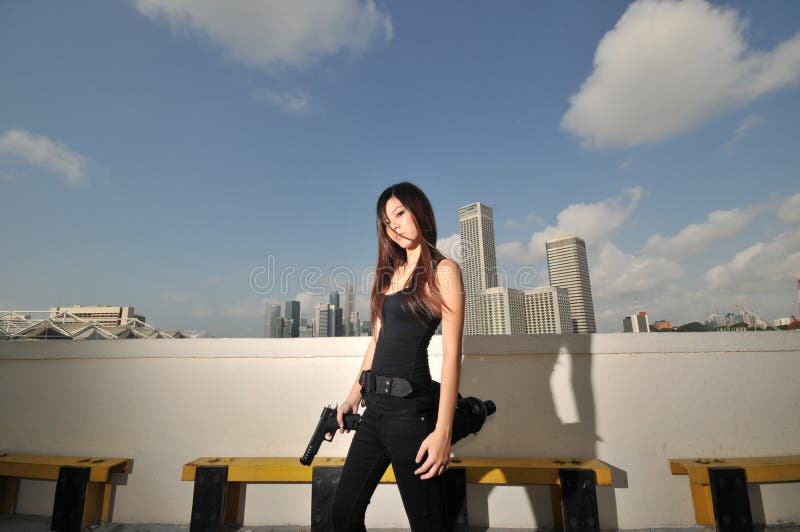 Asian Chinese Girl carrying a Pistol 2