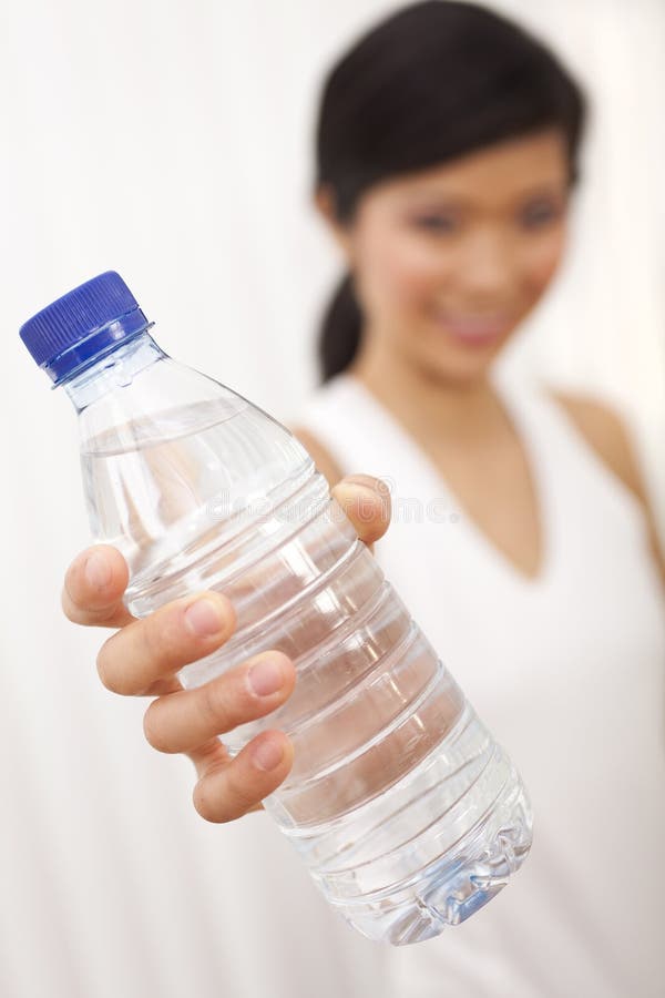 Asian Chinese Girl Holding Bottle of Pure Water stock photography Asian Chinese Girl Holding Bottle of Pure Water stock photography