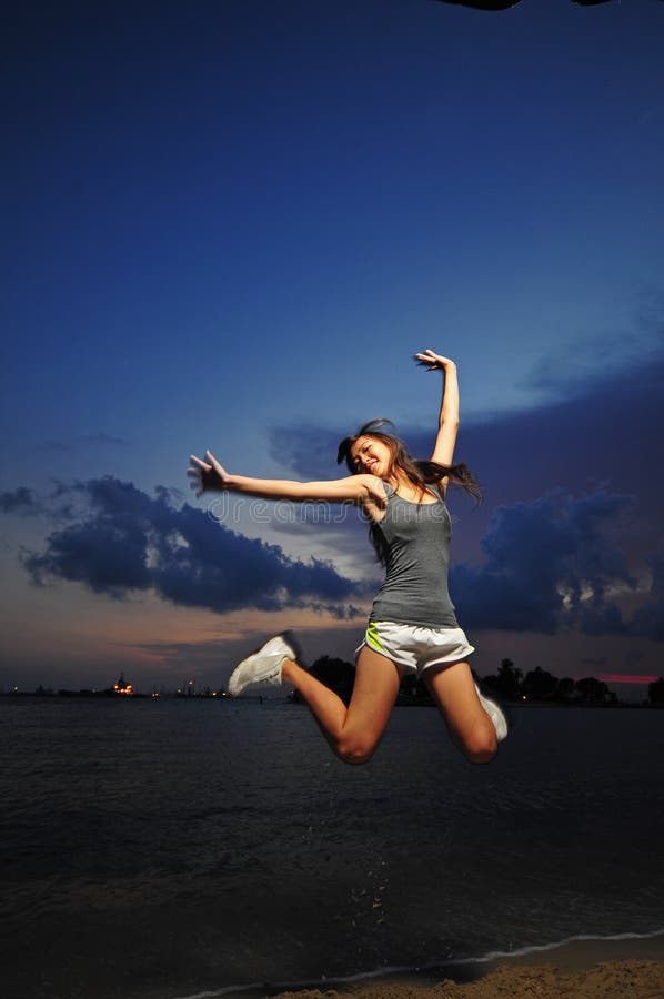 Asian Chinese Girl jumping for joy