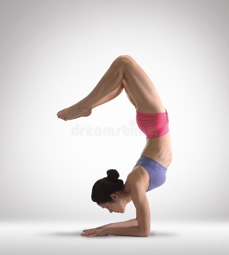 Asian Chinese Lady doing Yoga in colored clothing
