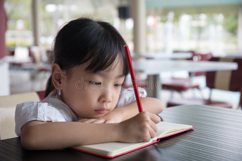 chinese restaurant kid doing homework