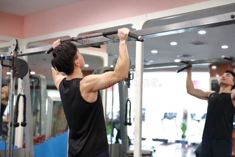 Asian chinese man in gym ï¼ŒGym training. Power, bodybuilding