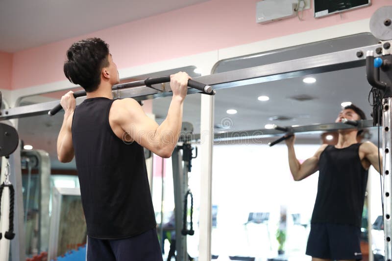 Asian chinese man in gym ï¼ŒGym training. Power, bodybuilding