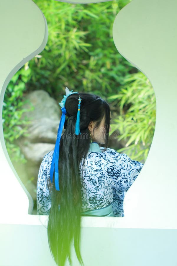 Asian Chinese Woman In Traditional Blue And White Hanfu Dress