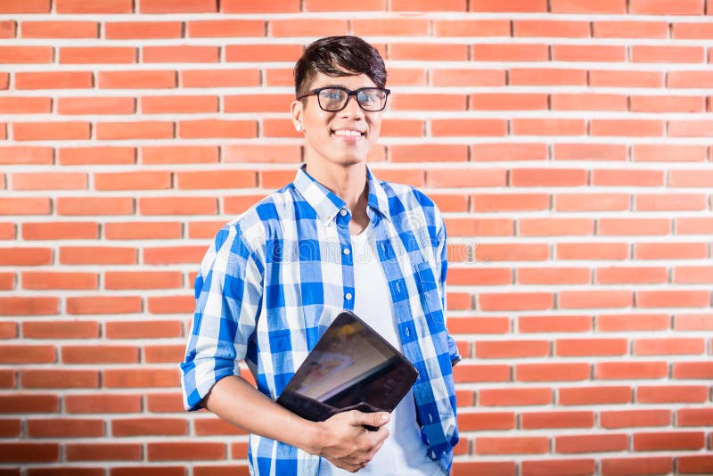 Asian College Student with tablet computer stock image Asian College Student with tablet computer stock image