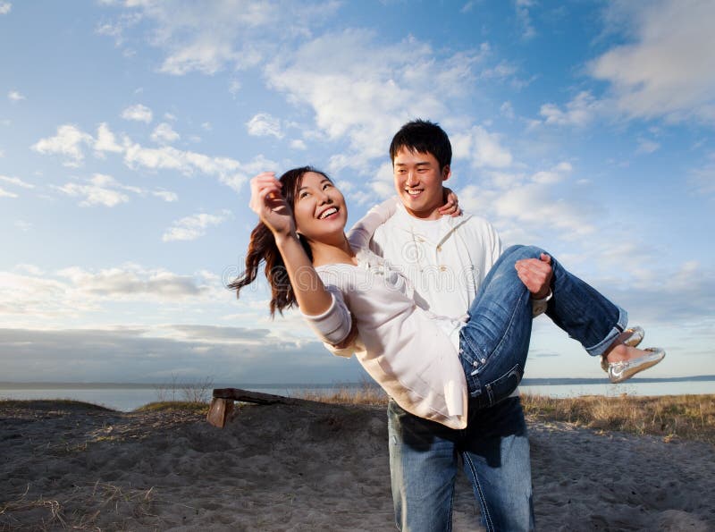 A portrait of an asian couple having fun outdoo stock photos.