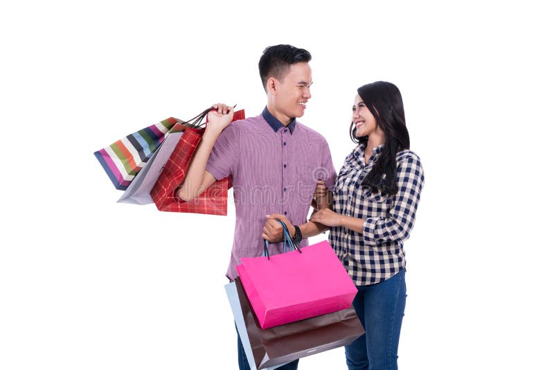 Asian couple carrying shopping bags royalty free stock photo Asian couple carrying shopping bags royalty free stock photo