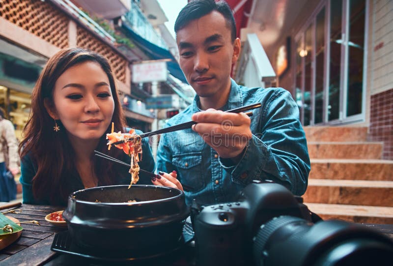 Asian couple are eating at chinese cafe