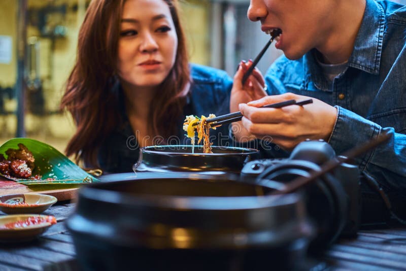 Asian couple are eating at chinese cafe