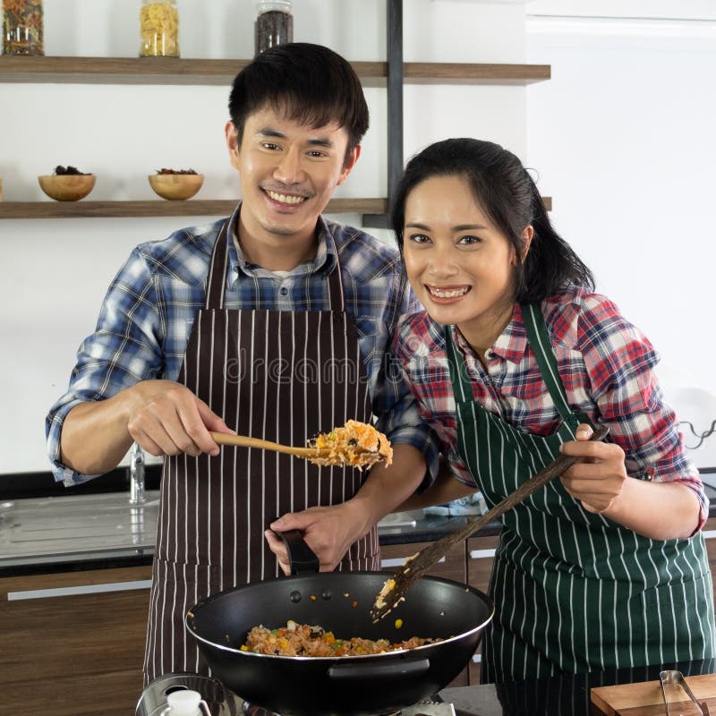 https://thumbs.dreamstime.com/b/asian-couple-happy-to-cook-together-morning-young-two-families-helping-each-other-prepare-kitchen-147027498.jpg