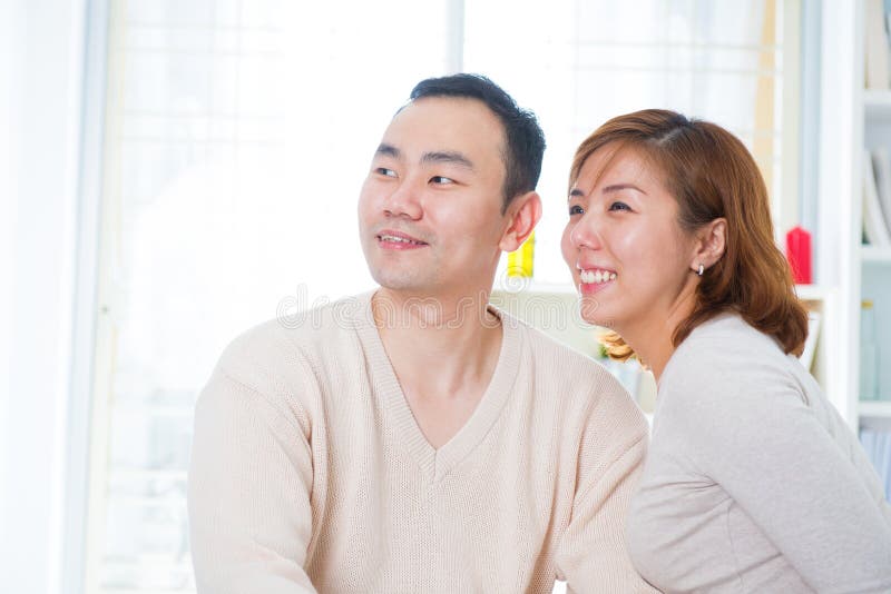 Asian couple looking away royalty free stock images.