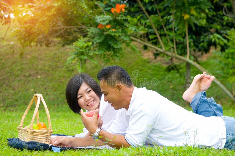 Outdoor watching asian couple