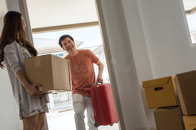 Asian couple move to new house