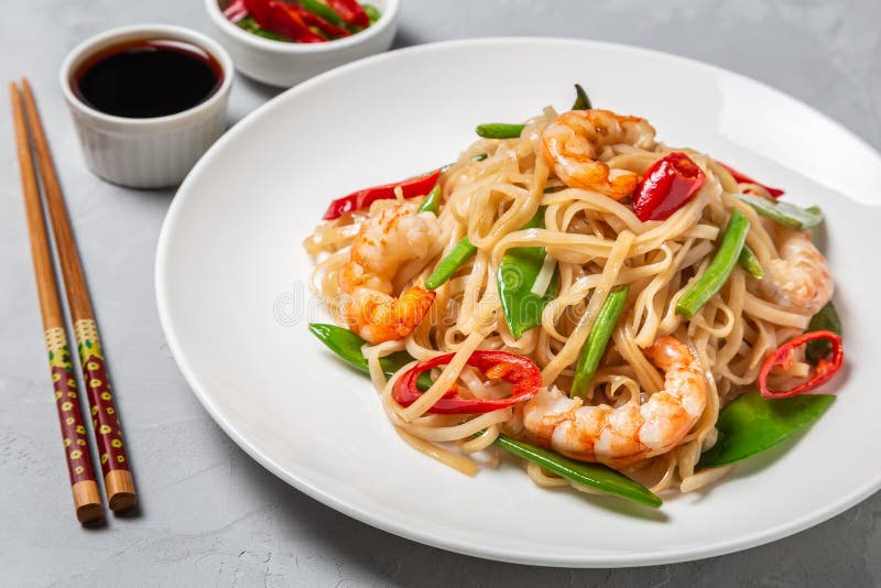 Asian Dish of Fried Rice Noodles with Shrimp and Vegetables Stock Image