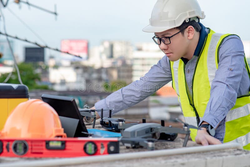 Asian engineer man using drone for site survey.