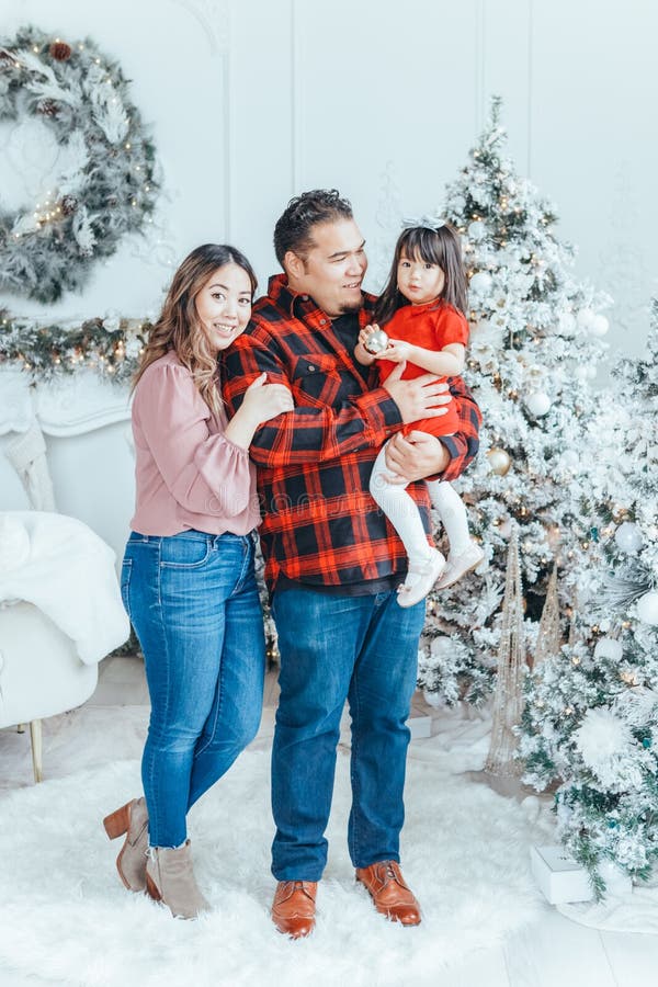 Asian Family Father Dad Hugging With Daughter Toddler Girl Celebrating  Christmas Or New Year. Mixed Race Dad Man With Kid Standing Stock Photo -  Image Of Home, Child: 235803690
