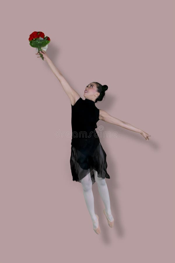 Asian female ballet dancer is dancing with bouquet flower royalty free stock images Asian female ballet dancer is dancing with bouquet flower royalty free stock images