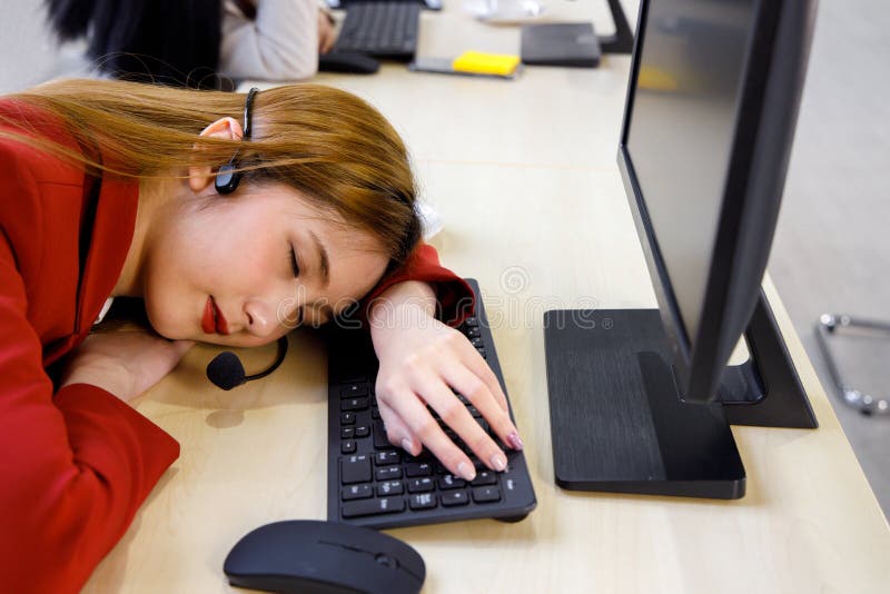 Scams and Fraud Asian-female-call-center-agent-sleeps-office-asian-female-call-center-operator-red-uniform-feels-tired-work-sleeps-207903348