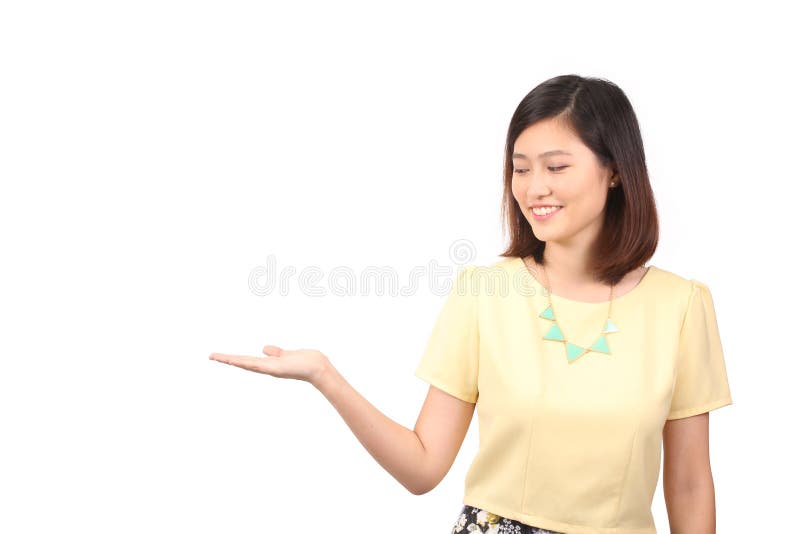 Asian female in casual wear holding out palm - Series 2 royalty free stock image Asian female in casual wear holding out palm - Series 2 royalty free stock image