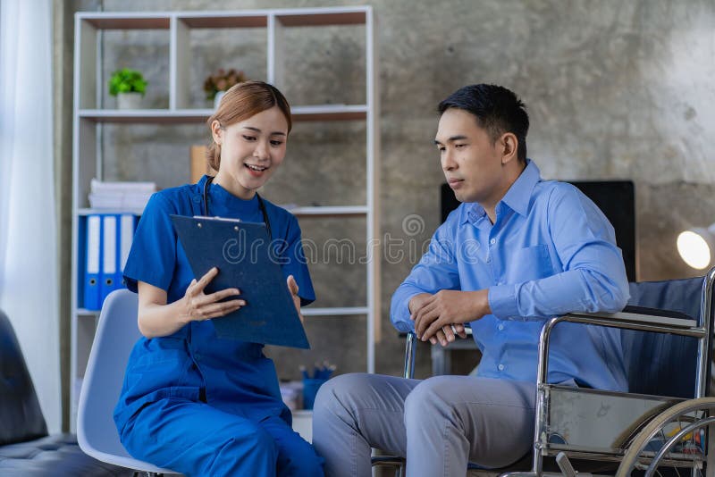 Asian female doctor giving advice and encouragement to a male stock image