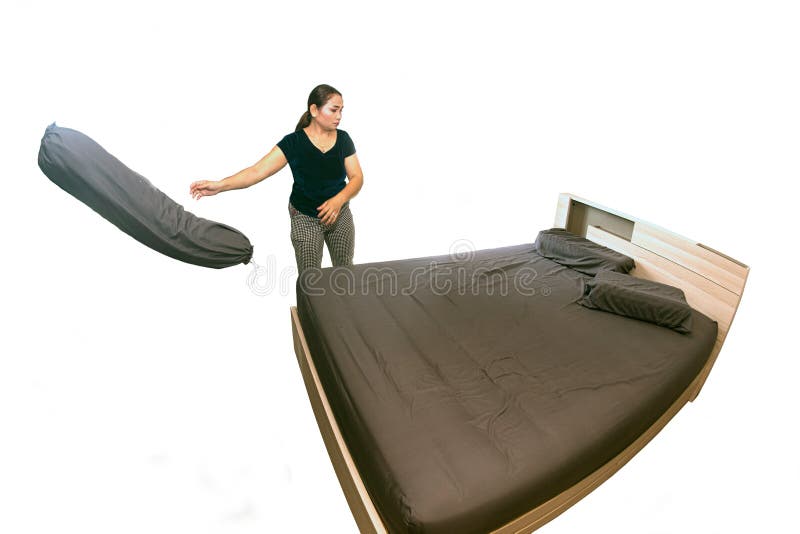 Asian female maid making bed in hotel room. Housekeeper Making Bed on white background with clipping path.