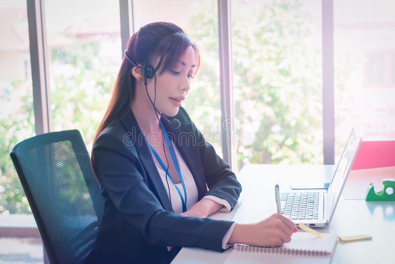 Female Operator is answering the phone for customer service sale and business consultant royalty free stock photography