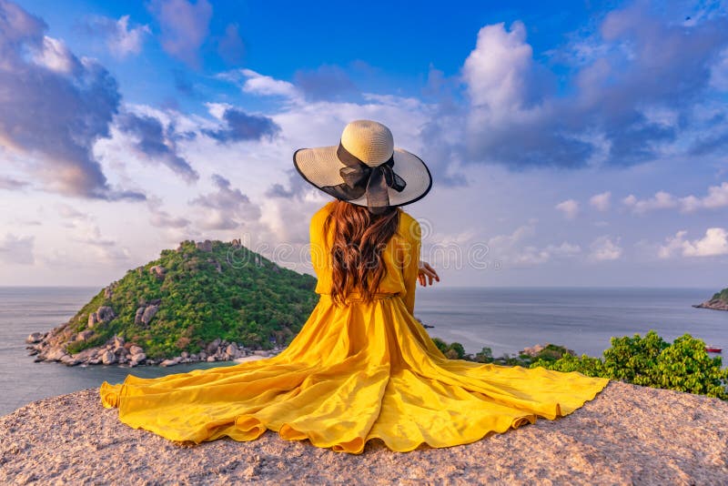 Asian female tourist sitting at the viewpoint on  Koh Nang Yuan island, Thailand