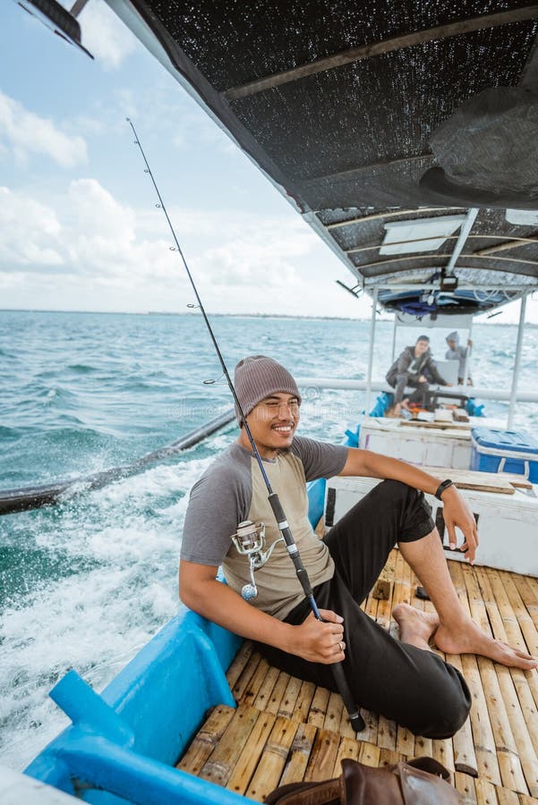 Asian Fisherman Sitting on a Fishing Break on a Boat Stock Photo - Image of  casting, break: 270911622