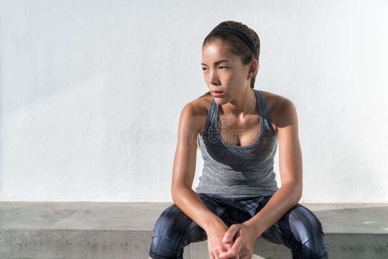 Asian fitness runner woman thinking during workout royalty free stock image Asian fitness runner woman thinking during workout royalty free stock image