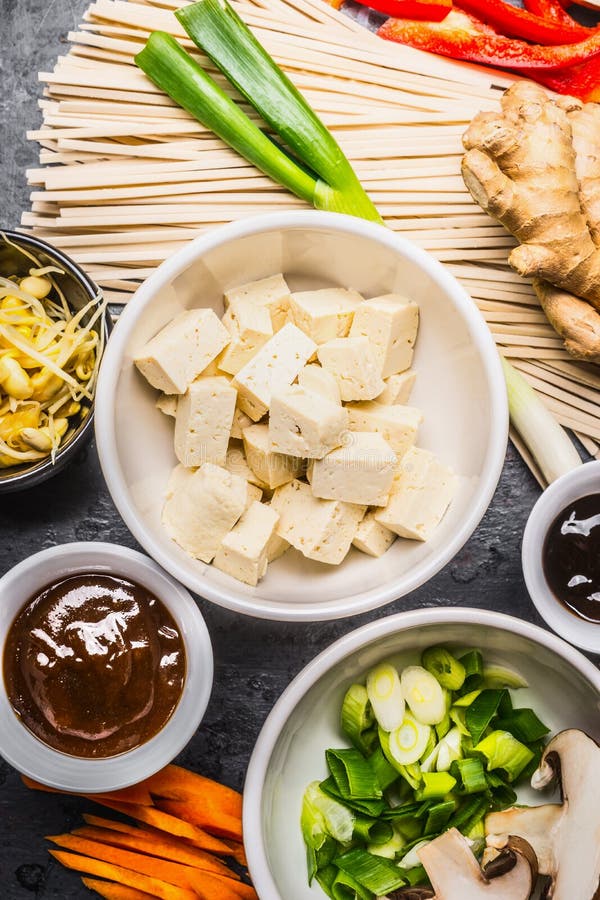 Asian food ingredients: tofu, noodles, ginger, cut vegetables, Sprout,green onion and hoisin sauce for tasty cooking