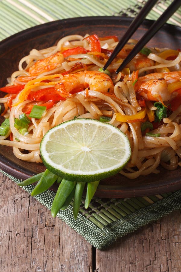 Asian Food: Rice Noodles with Shrimp and Vegetables Vertical Stock