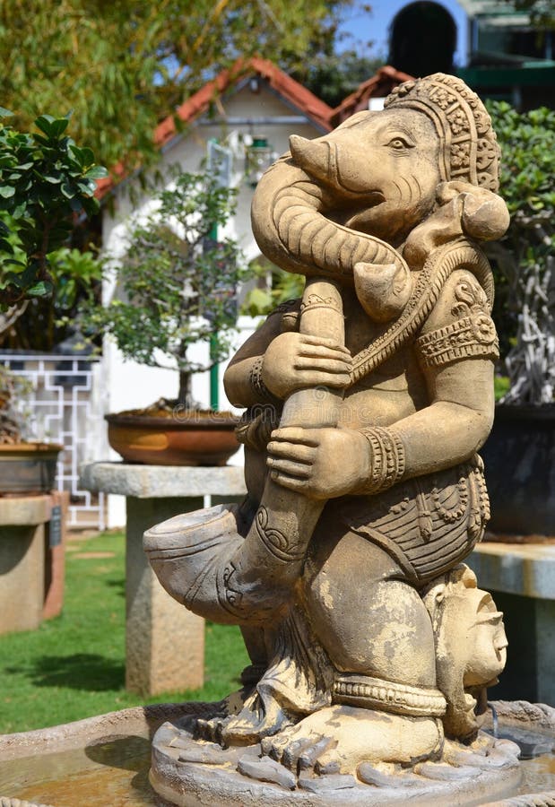 Asian statue in the garden stock photo. Image of lake 64009718