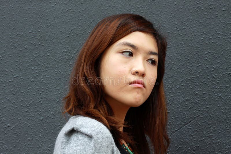 An asian girl with angry face