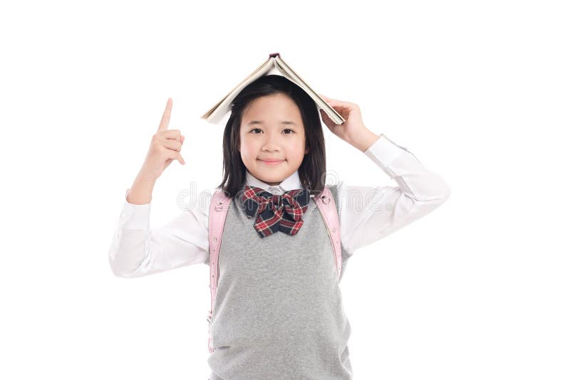 Asian girl with book on head stock photos Asian girl with book on head stock photos