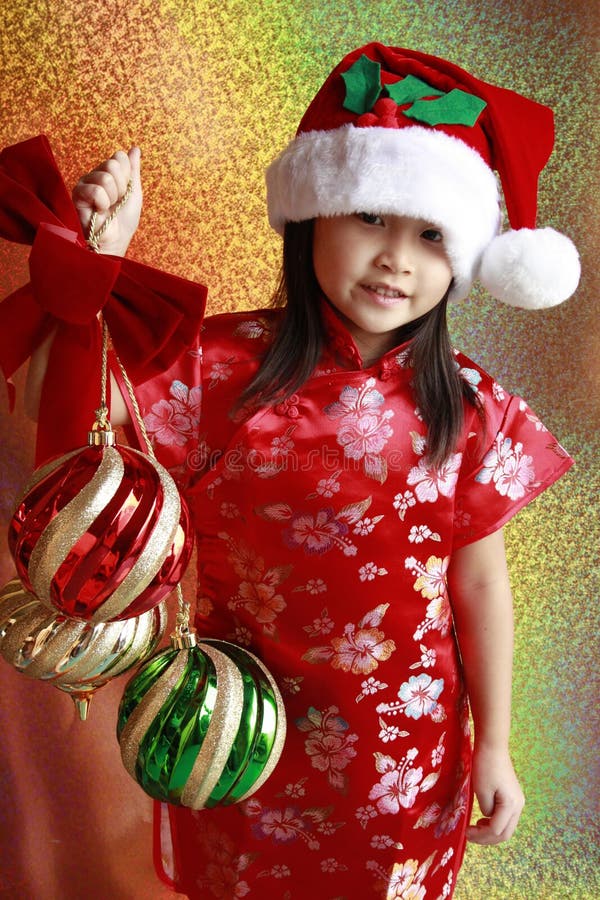 Asian girl with christmas balls