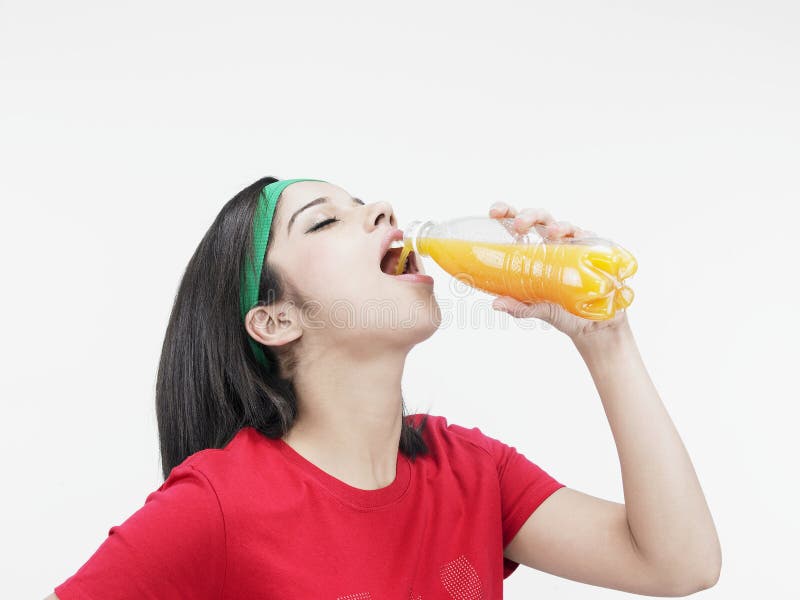 Asian girl drinking juice