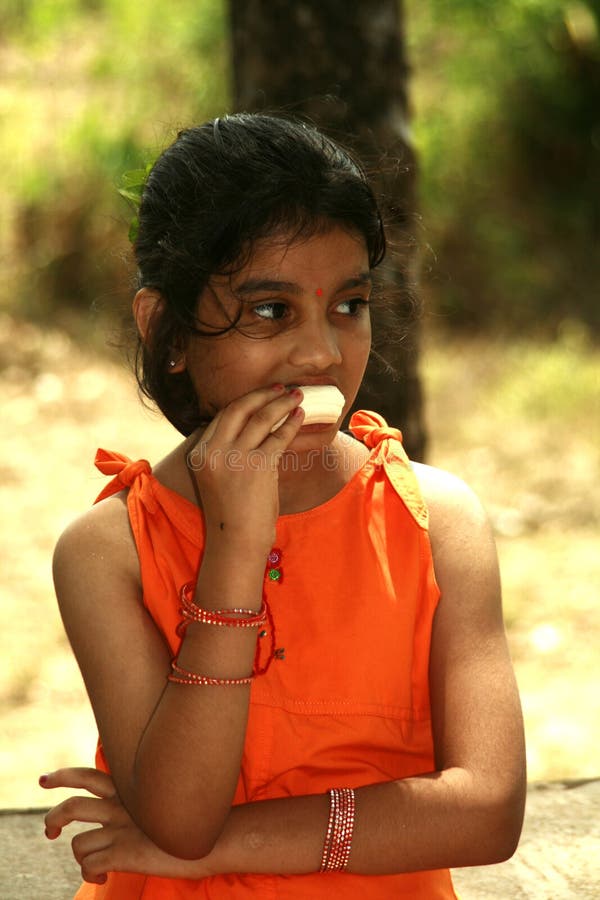 Asian girl eating banana