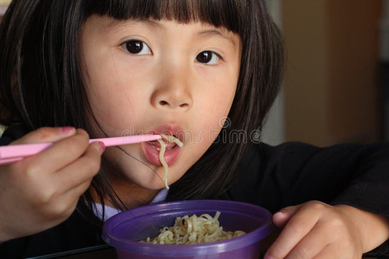 Asian Girl Eating Noodles