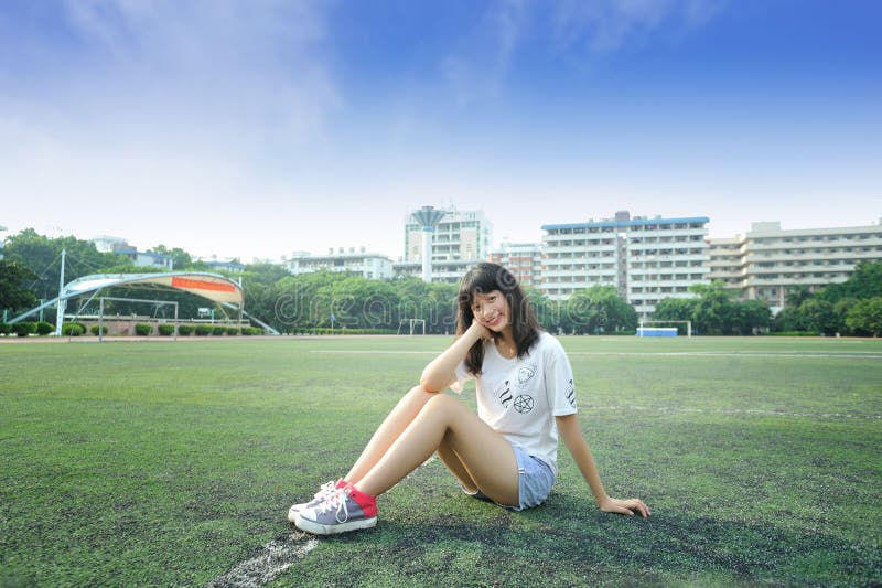 Asian girl in the football field of school