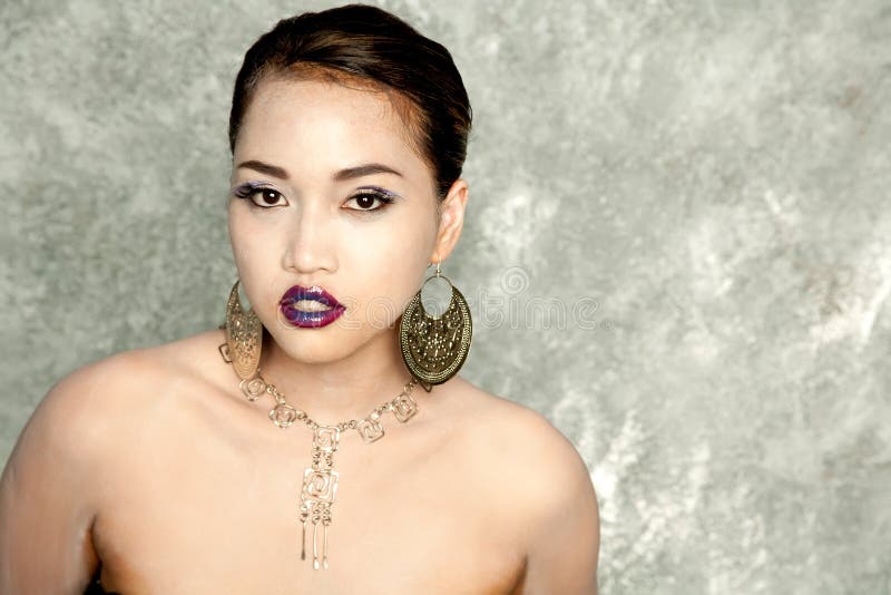 Asian girl with hairdo and makeup stock image