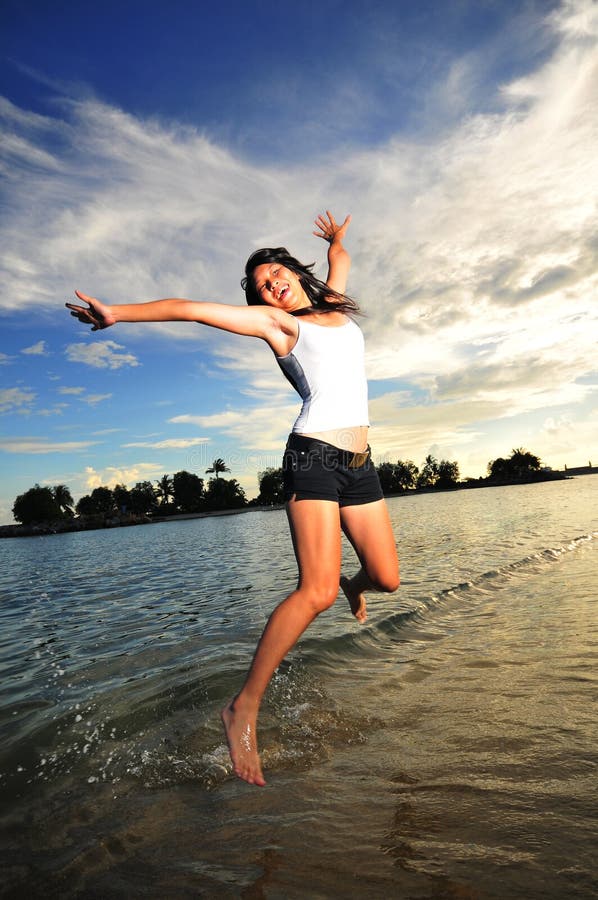 Asian Girl having Fun at the Beach